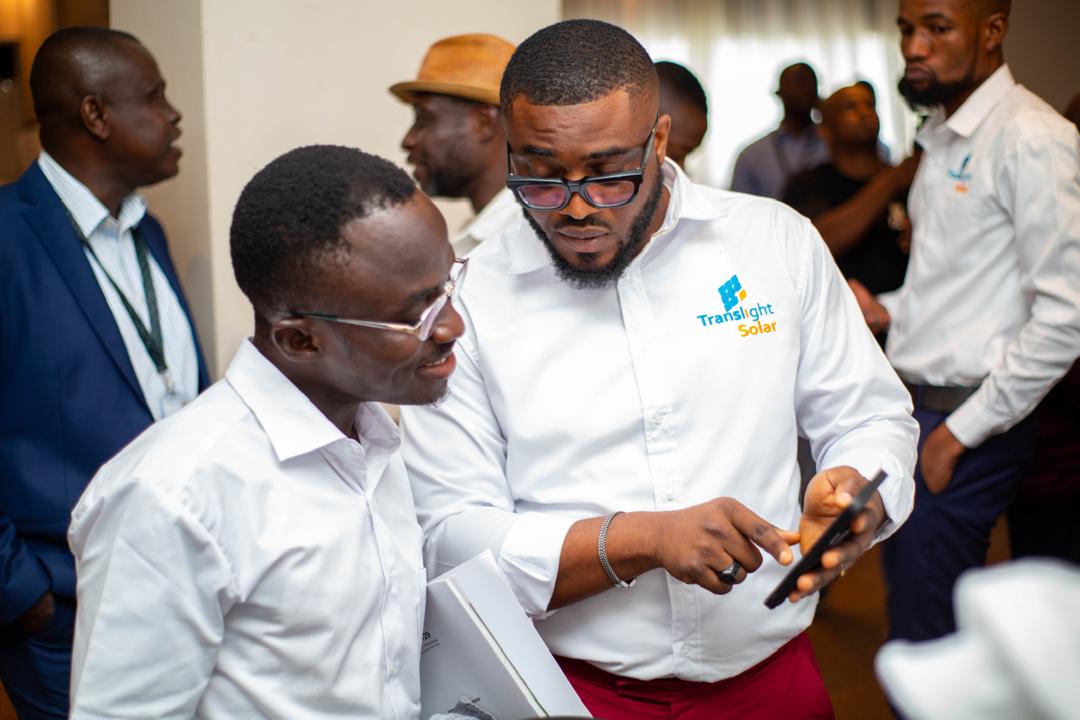 Translight Solar engineers talking with a client